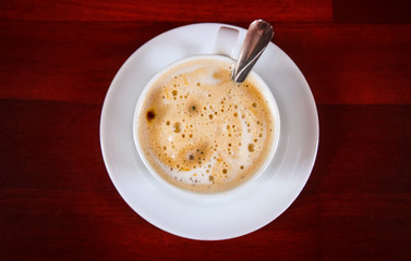 cup of coffee on wooden background