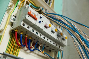 Electrician works servece. circuit breackers in switchbox