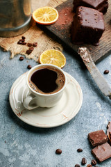 Cup of coffee on grey stone background.
