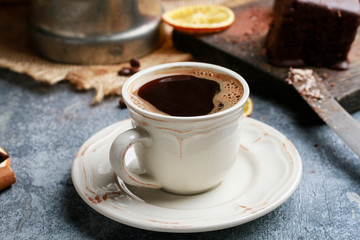 Cup of coffee on grey stone background.