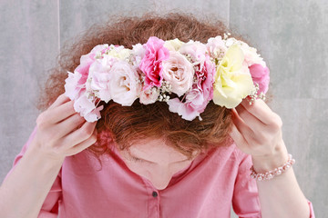Woman wearing beautiful wedding flower crown.