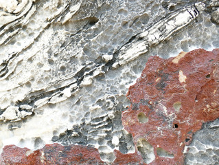 Texture of natural stone. Modern background. Image. Design for poster. Abstract backdrop. Black, grey, biege, sepia. Hole on the surface. Patterns and textures of rocks in nature. Closeup detail stone