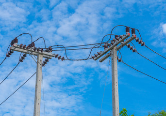 The electric pole and electric transformer with cloud blue sky