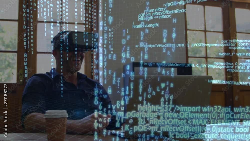 Poster man wearing virtual goggles while using a laptop