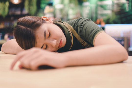 Tired woman sleeping at workplace at Lunch break. - Image