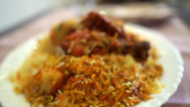 Delicious spicy chicken biryani and Indian sweet Saffron Rice / Zarda rice, it�s a popular Indian and Pakistani food.
