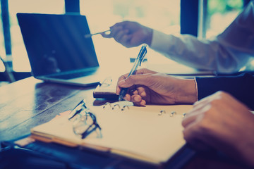 Discussing plan and idea to improvement strategy, businessmen brainstorming for strategy of business investment,businessmen review chart and document of investment information