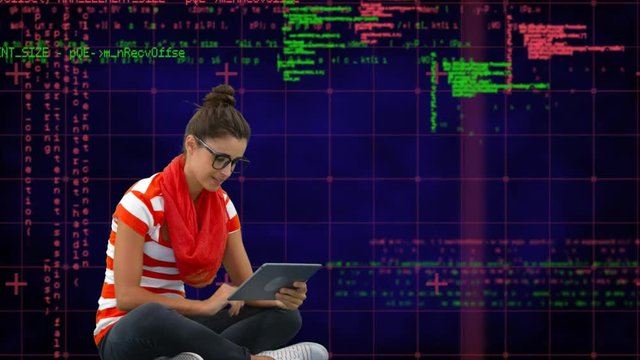 Woman seated on the floor using a tablet