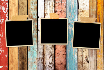 Three retro photos on old wooden wall