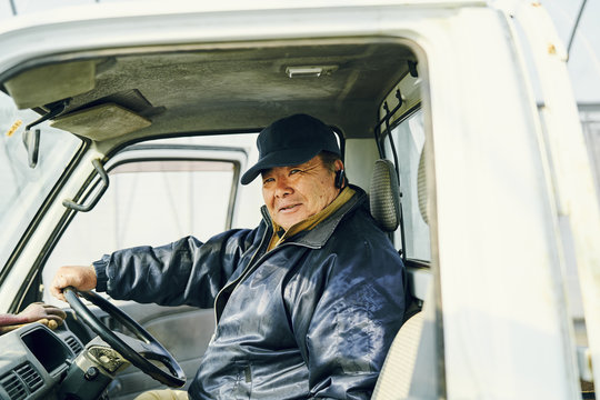 Portrait Of Mature Man Sitting In Car