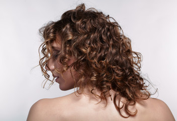 Woman from backside with curly hair