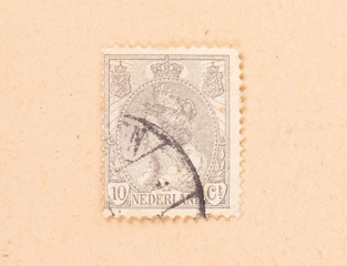 THE NETHERLANDS 1950: A stamp printed in the Netherlands shows the queen, circa 1950