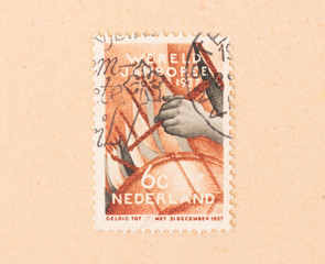 THE NETHERLANDS 1950: A stamp printed in the Netherlands shows someone playing the drums, circa 1950