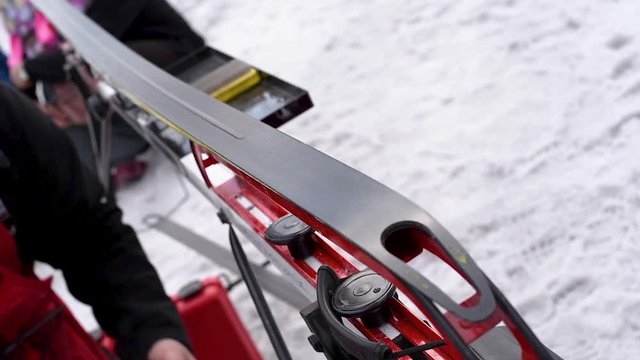 Lubrication of cross-country skis for better sliding on snow . Preparation for cross-country skiing competitions 