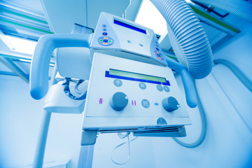 X-ray room in a hospital. Classic ceiling-mounted x-ray system.