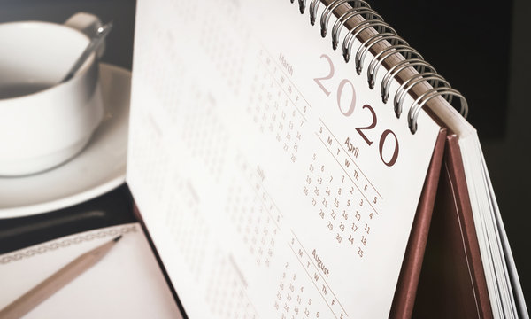 Happy new year 2020 concept: Close up calendar on desktop 