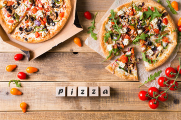 Vegetable italian pizza with tomatos on wodeen background