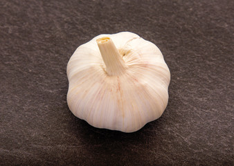 Garlic on black background.