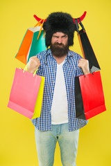 Man mad face wear hat bull with horns. Hipster shopping addicted or shopaholic. Shopping concept....