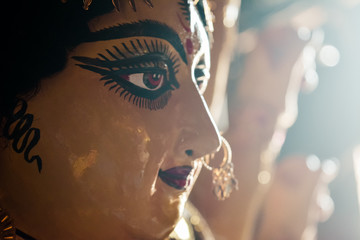 Close up side view face of Goddess Maa Durga Idol. A symbol of strength and power as per Hinduism....