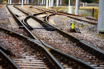 Fototapeta na wymiar Close up railroad tracks on countryside landscape