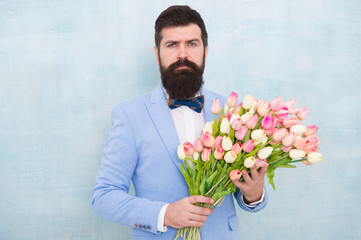 spring bouquet. 8 of march. love date with flowers. Happy Birthday. bearded man in bow tie with tulip flowers. womens day. Formal mature businessman bride groom at wedding party. Spring in my heart