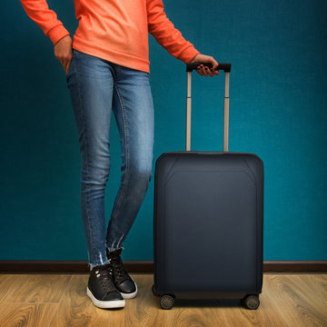 Young girl posing with baggage