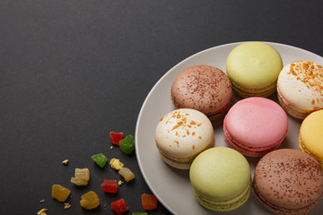 Colorful pastel cake macaron or macaroon on plate.