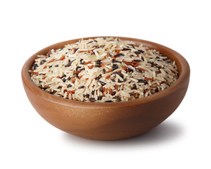 Mixed rice in a wooden bowl. Isolated on white background. Natural products. Healthy food.