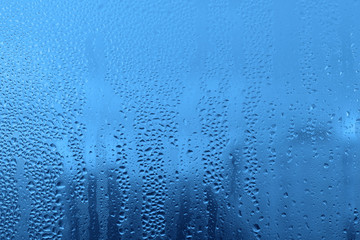 Natural water drops on glass