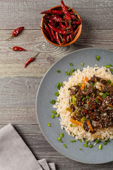 Traditional Korean Bulgogi dish.  Thinly cut, grilled beef, served with rice and vegetables.
