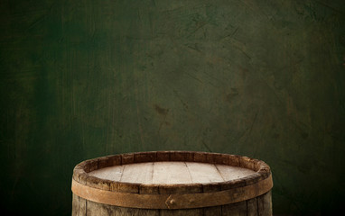 Wooden barrel on a table and textured background