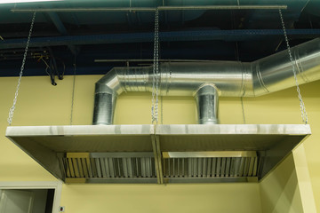 Fototapeta premium Stainless steel industrial kitchen hood. Professional kitchen equipment.