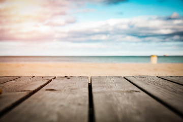 Naklejka na ściany i meble Table background and summer beach 