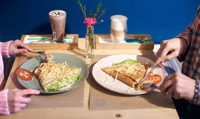 Beautiful served dish with vegetables and cheese. Delicious food and beverages on table. High angle...