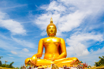 Big Golden Buddha with blue sky blue at Wat Muang, Ang Thong Province, Thailand