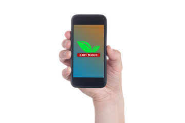 Hand holding black smartphone with text "ECO Mode" on smartphone screen. Ecology and economy concept