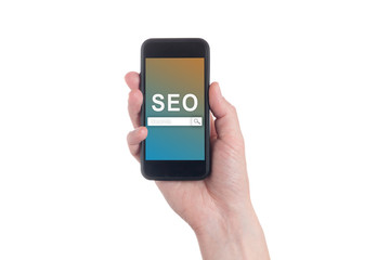 Hand holding black smartphone with text SEO (Search Engine Optimization) on smartphone screen. White backgroun. Seo concept