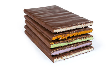 Bars of milk chocolate with different filling on white background
