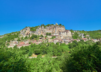 Landscape panoramic view of the medieval french village of Rocamadour, on a cliff of the alzou (dordogne) river valley, Lot Department, Quercy, Occitanie Region, France. UNESCO world heritage site.