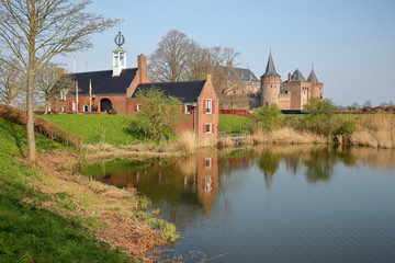 Naklejka na ściany i meble Reflections of Muiderslot Castle, a medieval castle located in Muiden, Netherlands