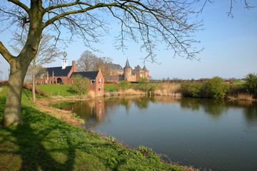 Fototapeta premium Reflections of Muiderslot Castle, a medieval castle located in Muiden, Netherlands