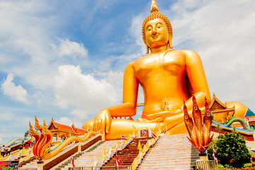 Obraz premium Big Golden Buddha with blue sky blue at Wat Muang, Ang Thong Province, Thailand