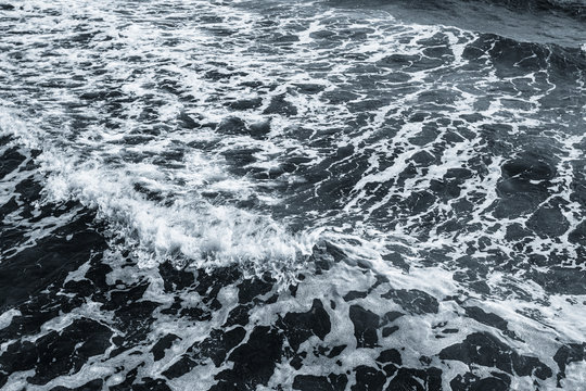 Beautiful surfing waves of sea blue foamy splashing water. Dramatic marine  photo background.