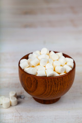 Fototapeta na wymiar Marshmallow in a wooden bowl