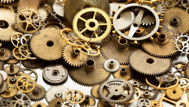 Aged pocket watch clockwork mechanism parts macro view. Collection different cogwheels teeth shapes size objects