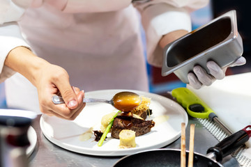 Chef preparing food, meal, in the kitchen, chef cooking