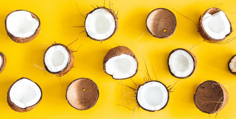 Summer composition. Coconut banner on yellow background. Summer concept. Flat lay, top view