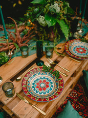 Stylish wedding table with decor, candles, dishes and floristic. Wedding dinner