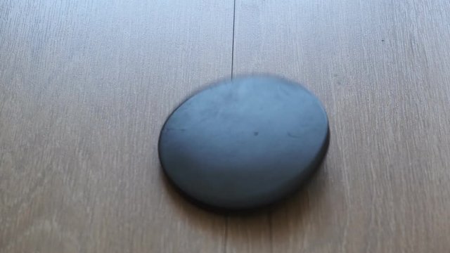 ebonite disc spinning on the floor